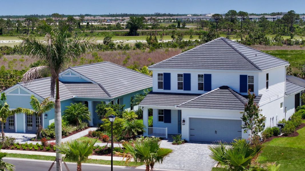 Front exterior of a home in the Palmera Real Estate and Homes for Sale in Venice, FL - Neal Communities community, located in Venice, FL (Image 7). Front exterior of a home in the Palmera Real Estate and Homes for Sale in Venice, FL - Neal Communities community, located in Venice, FL (Image 7).