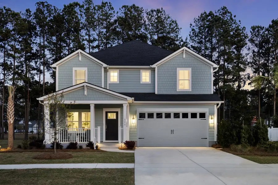 Front exterior of a home in the The Coves at Lakes of Cane Bay community, located in Summerville, SC (Image 4). Front exterior of a home in the The Coves at Lakes of Cane Bay community, located in Summerville, SC (Image 4).