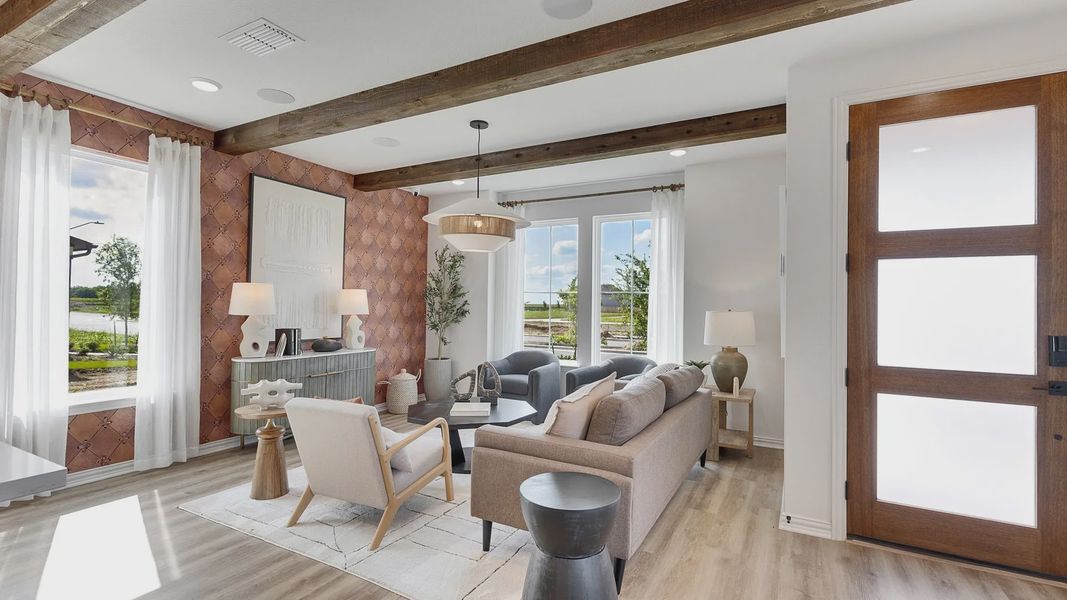 Luxurious design features rustic beams, expansive windows, plush furnishings in Spring Creek.