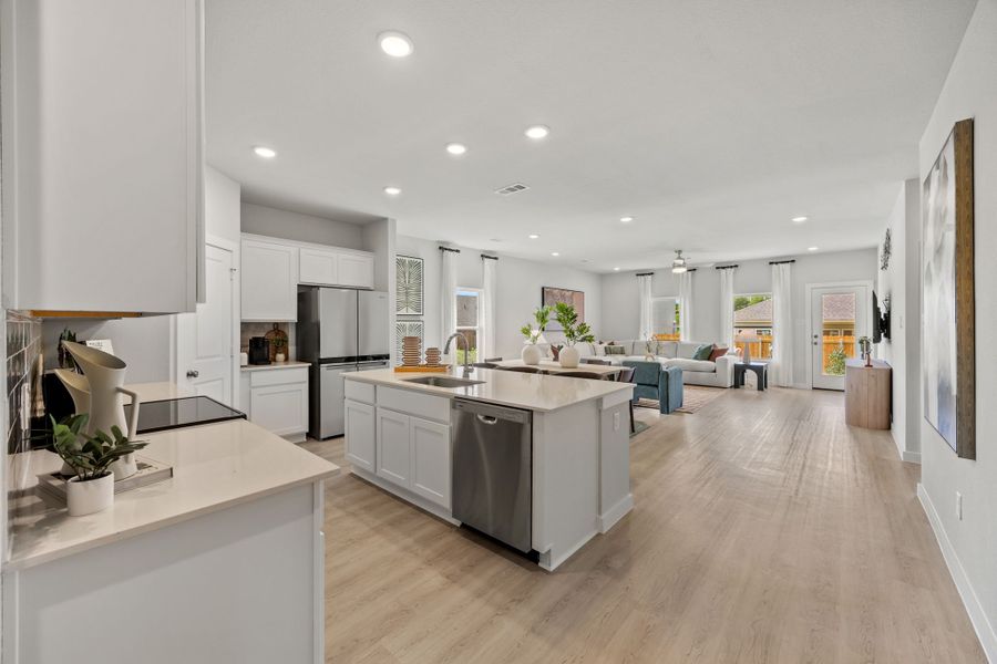 A kitchen with white cabinets. A kitchen with white cabinets.