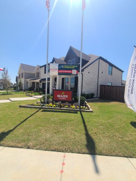 A beautiful brick home with landscaped garden in Valencia on the Lake by Beazer Homes (Little Elm, TX).