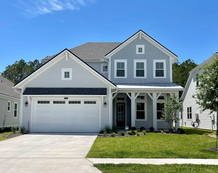 Front exterior of a home in the Mariposa at EverRange community, located in Jacksonville, FL (Image 7).