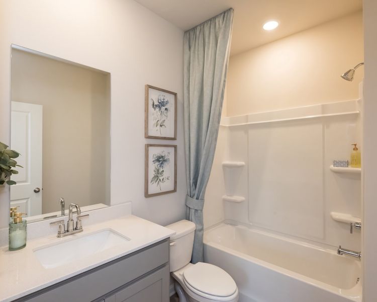 A fresh and functional bathroom for shared use. A fresh and functional bathroom for shared use.