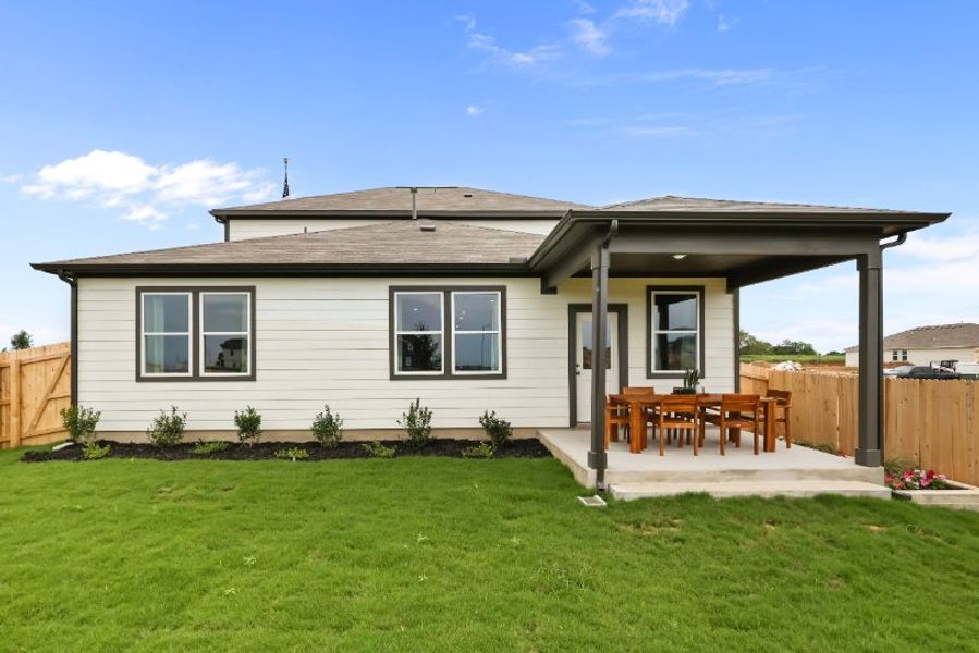 A house with a fence and lawn. A house with a fence and lawn.