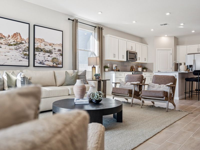 A living room with a couch and a table.