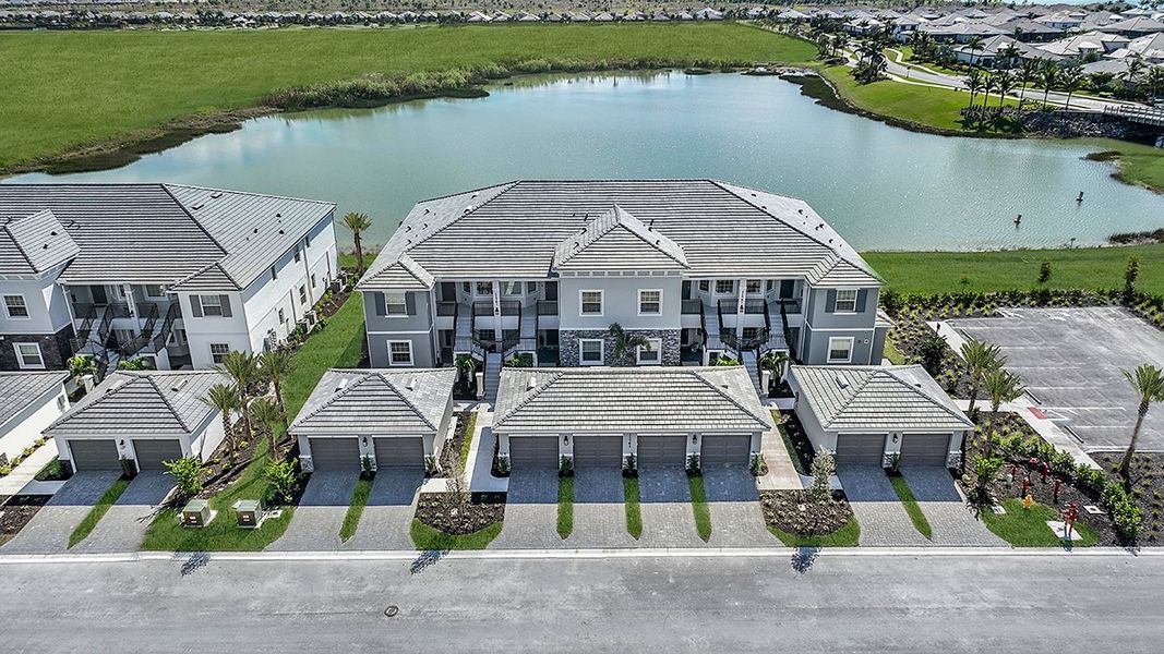 Front exterior of a home in the Esplanade Lake Club Condos community, located in Fort Myers, FL (Image 37).