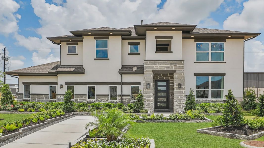 Elegant stone facade and lush gardens enhance this Texas villa in Beamer Villas. Elegant stone facade and lush gardens enhance this Texas villa in Beamer Villas.