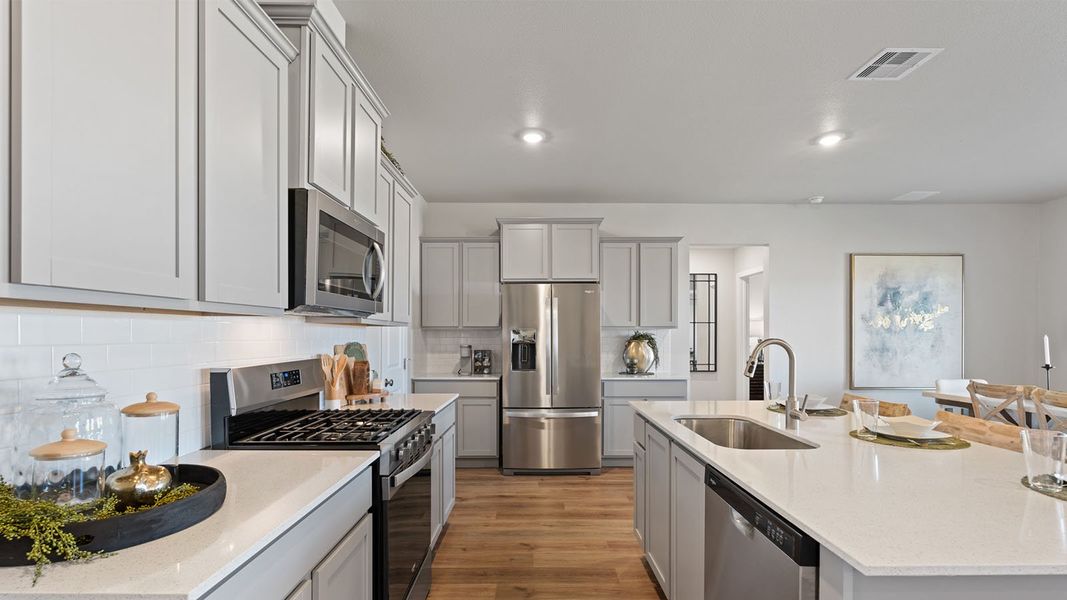 Furnished interior in a model home at King's Landing in Corpus Christi (Image 3).