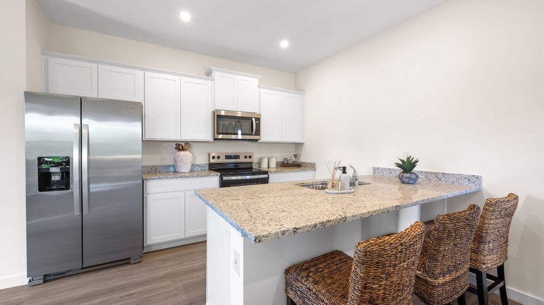 Furnished interior in a model home at Belcourt Landing in Cleveland (Image 5).