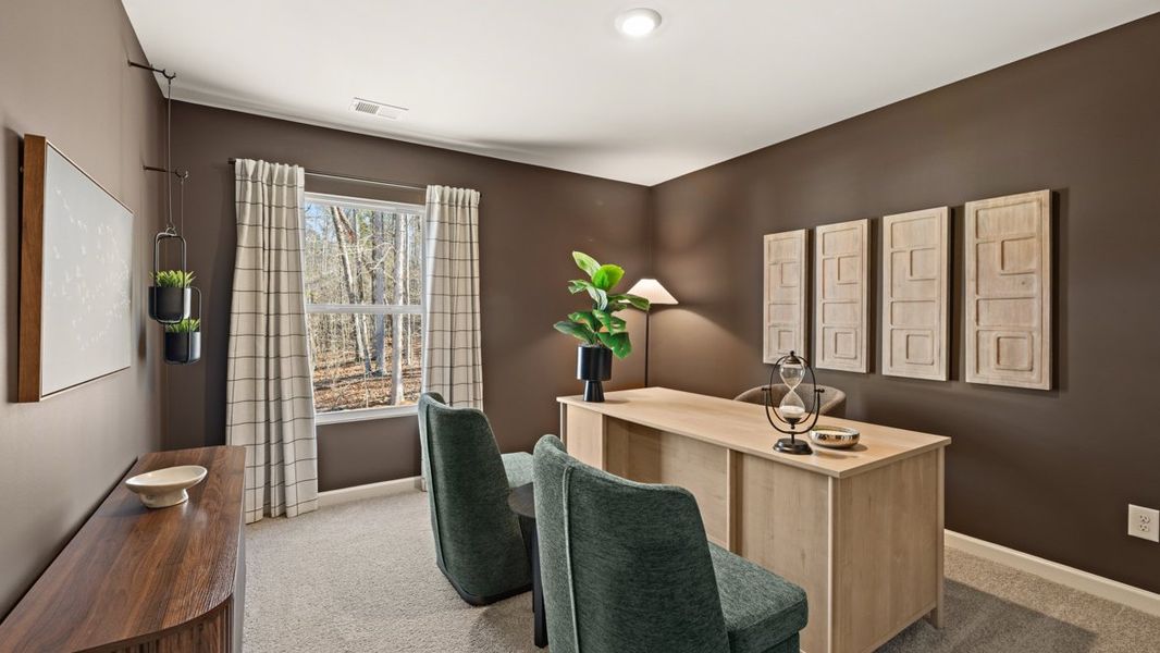 Furnished interior in a model home at South Wind in Fairburn (Image 22).