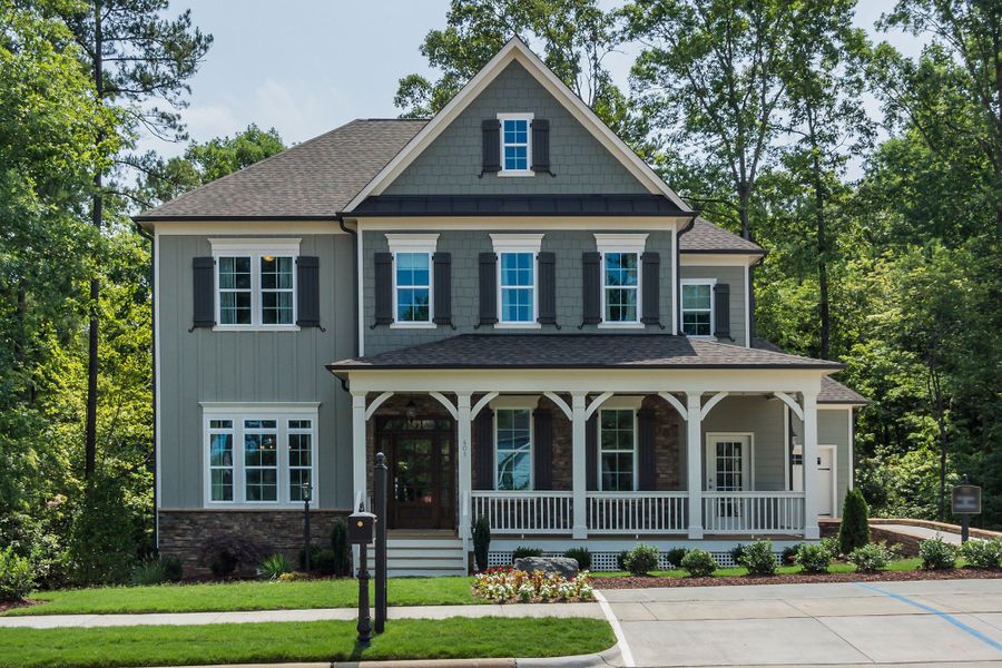 Front exterior of a home in the Holly Springs – 12 Oaks - Robuck Homes community, located in Garner, NC (Image 8). Front exterior of a home in the Holly Springs – 12 Oaks - Robuck Homes community, located in Garner, NC (Image 8).