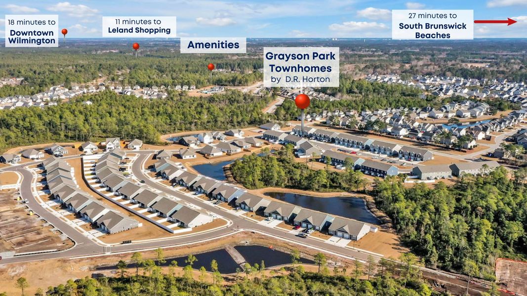 Aerial view of the Grayson Park Townhomes community in Leland, NC, showing layout and nearby surroundings (Image 1).