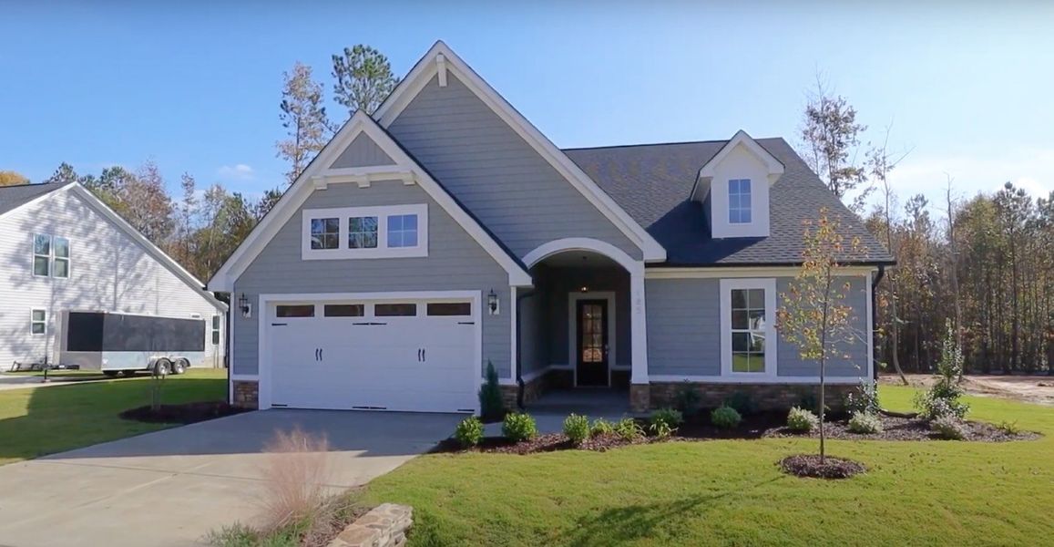 Front exterior of a home in the WyndWater community, located in Hampstead, NC (Image 6).