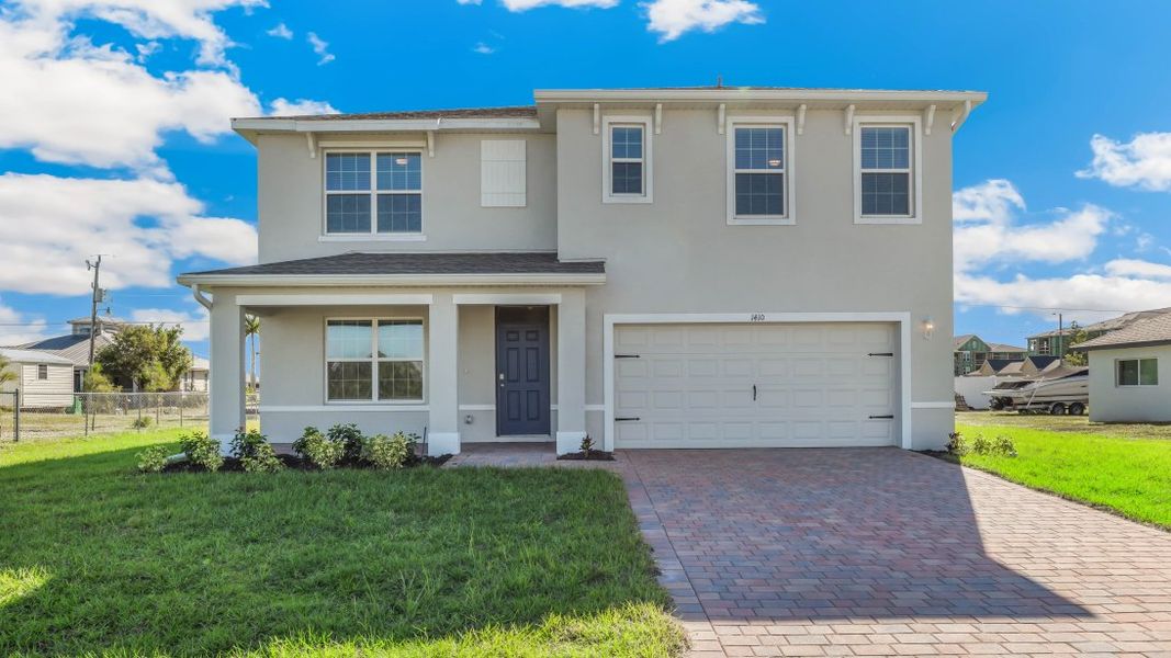 Front exterior of a home in the Cape Coral Water & Sewer community, located in Cape Coral, FL (Image 11).