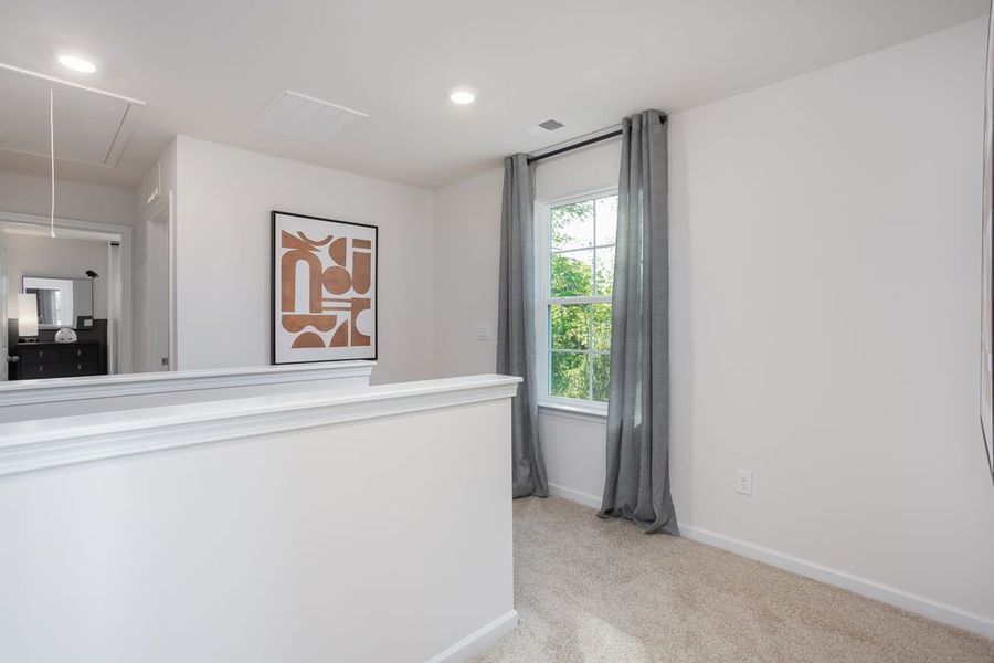 Furnished interior in a model home at The Grove at Riley's Meadow in Haw River (Image 12).