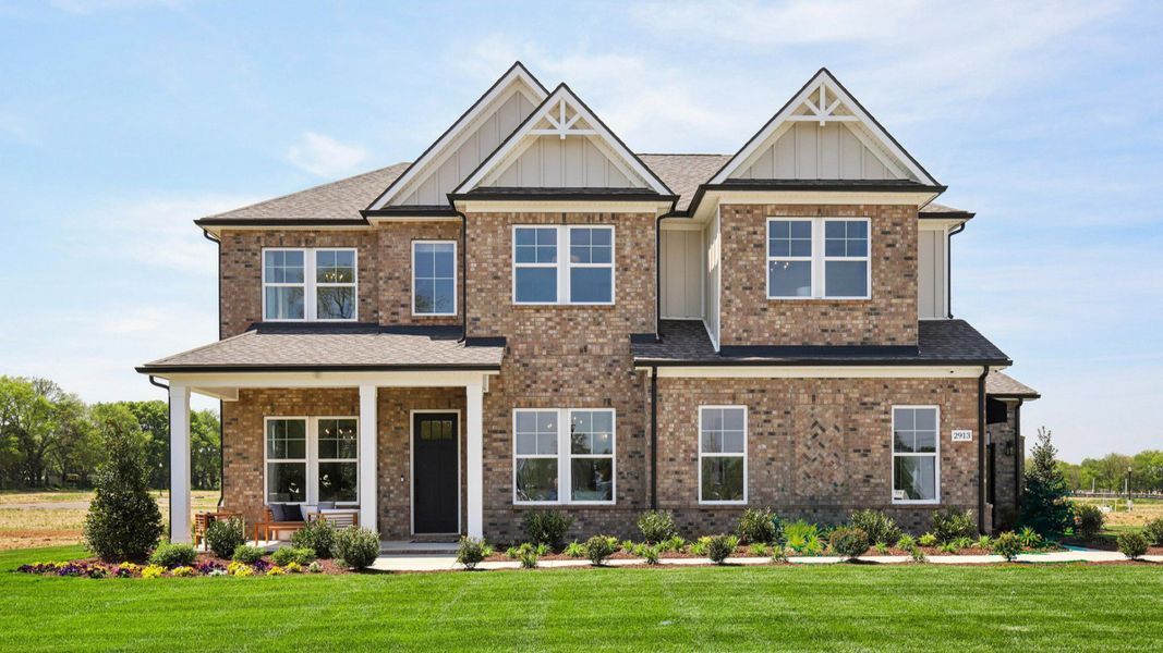 Full brick front exterior with siding accents and a side-entry 3-car garage