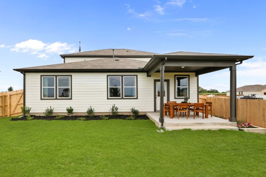 A house with a fence and lawn. A house with a fence and lawn.