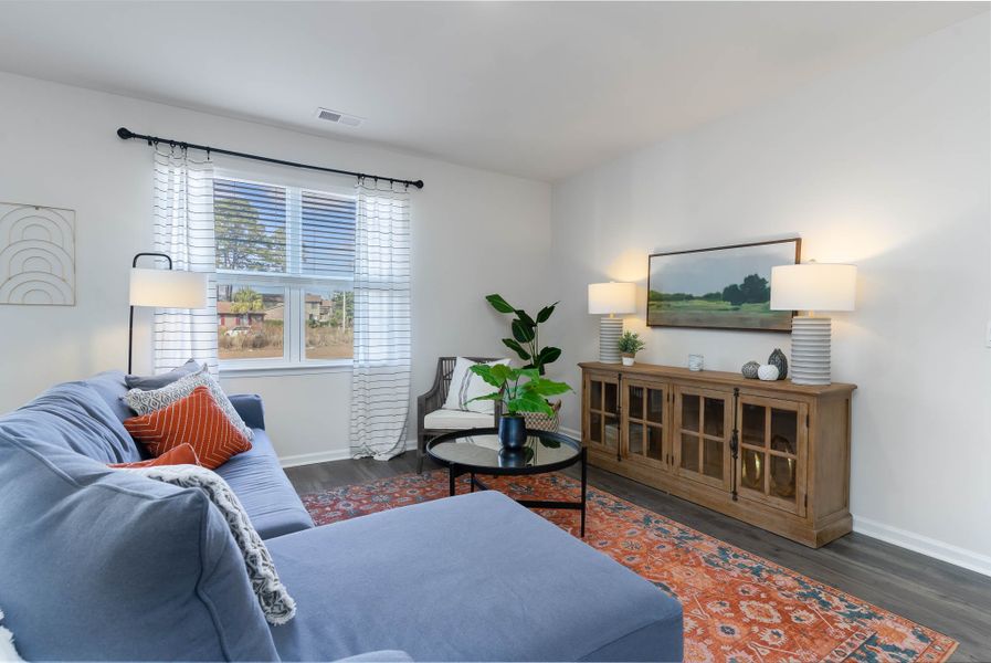 Furnished interior in a model home at Island Green in Myrtle Beach (Image 31).