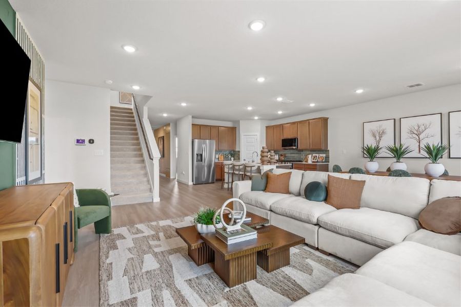 A living room with a couch and a table. A living room with a couch and a table.