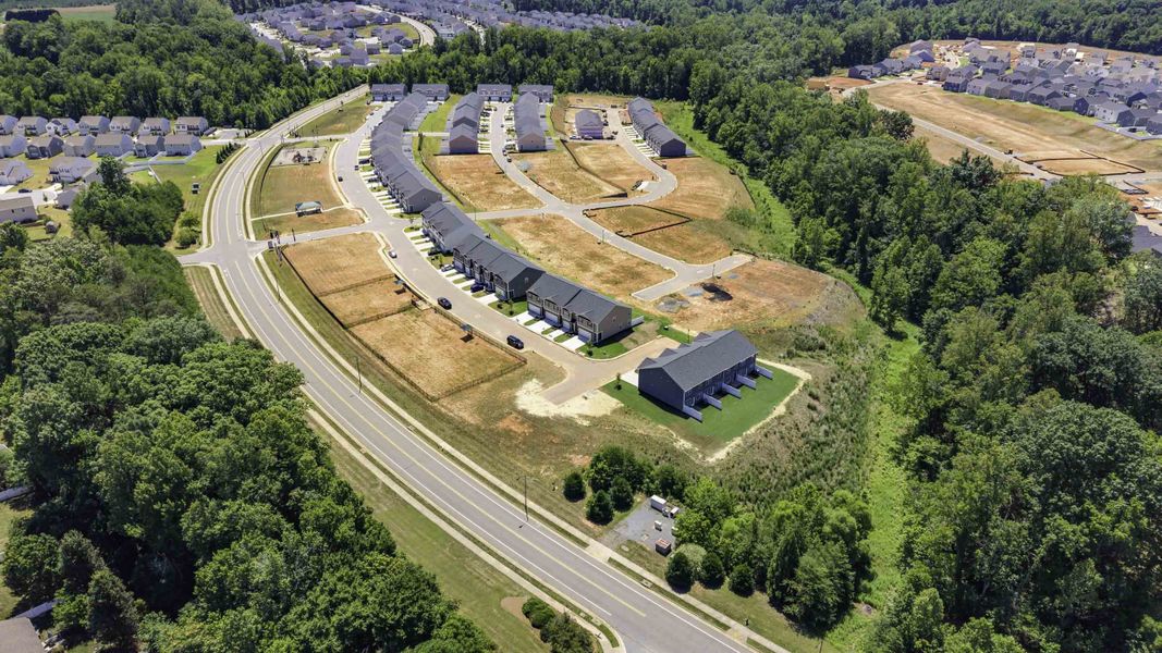 Aerial view of the North Village Townes community in Greensboro, NC, showing layout and nearby surroundings (Image 11). Aerial view of the North Village Townes community in Greensboro, NC, showing layout and nearby surroundings (Image 11).