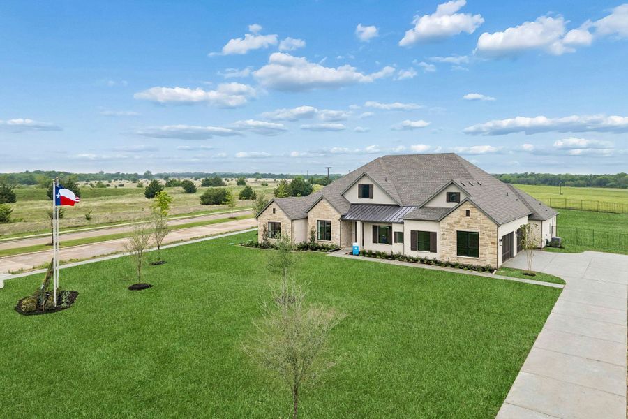 Front exterior of a home in the Discovery Lakes community, located in Rockwall, TX (Image 10).