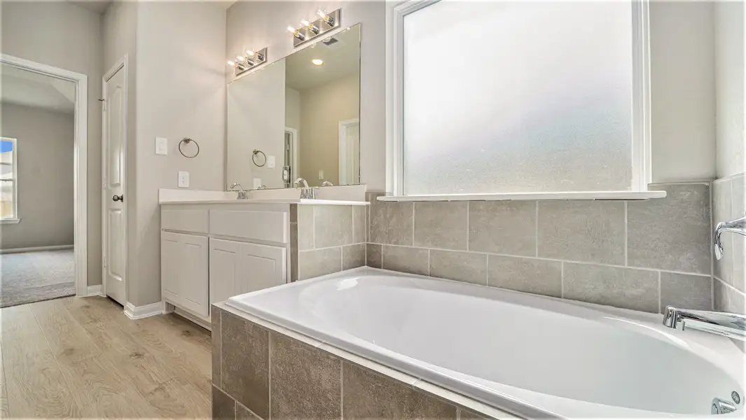 Furnished interior in a model home at Meadow Glen in Conroe (Image 3).