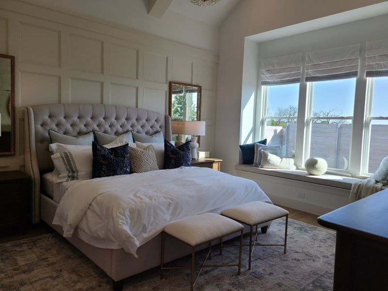 A serene bedroom with a tufted headboard, cozy bedding, and a sunlit window seat, perfect for relaxation. A serene bedroom with a tufted headboard, cozy bedding, and a sunlit window seat, perfect for relaxation.