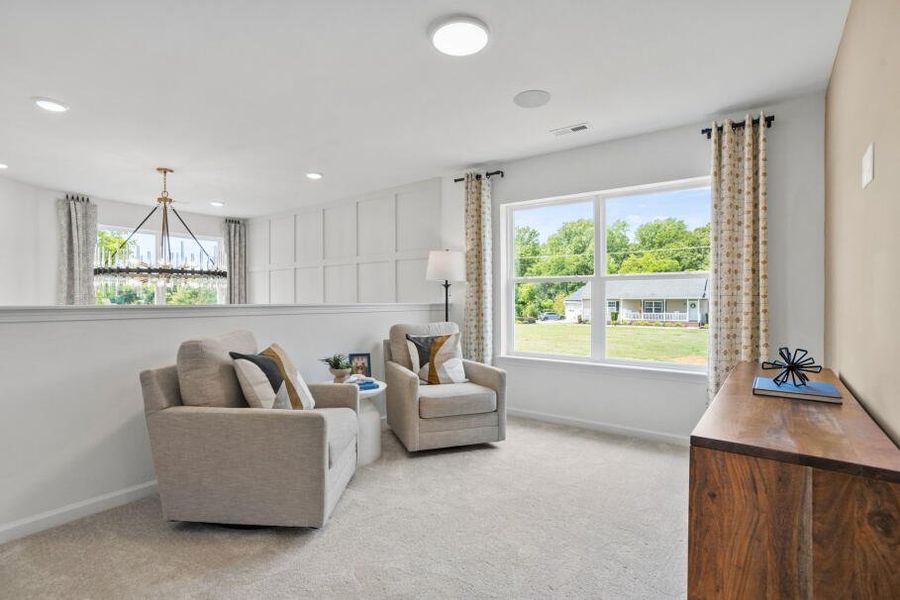 Furnished interior in a model home at CraigStone in Woodruff (Image 10).