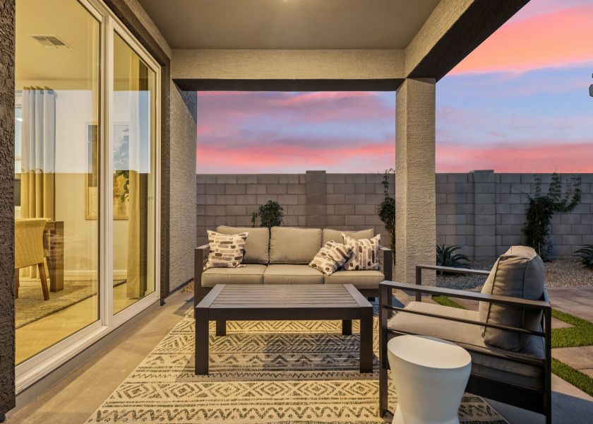 A living room with a glass door. A living room with a glass door.
