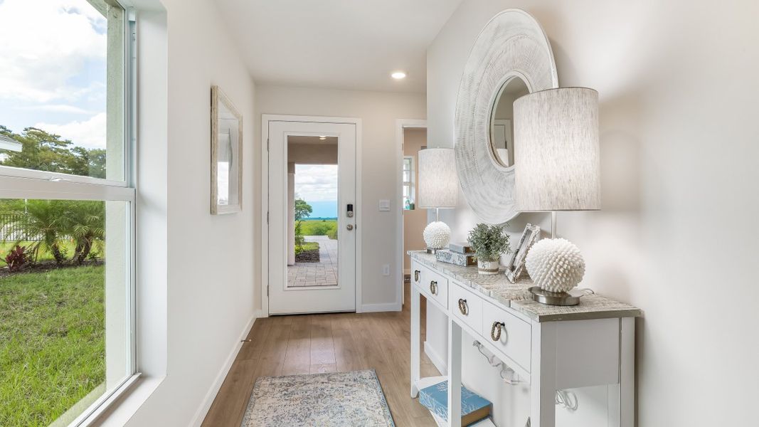 Furnished interior in a model home at Cali Cove in Punta Gorda (Image 14).