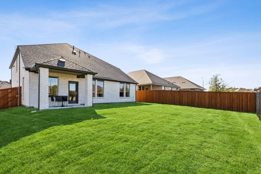 REPRESENTATIVE PHOTO – Covered Patio in the Winters model home in Aledo TX by Trophy Signature Homes