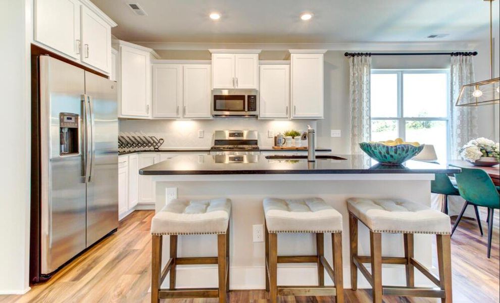 Furnished interior in a model home at CraigStone in Woodruff (Image 7).