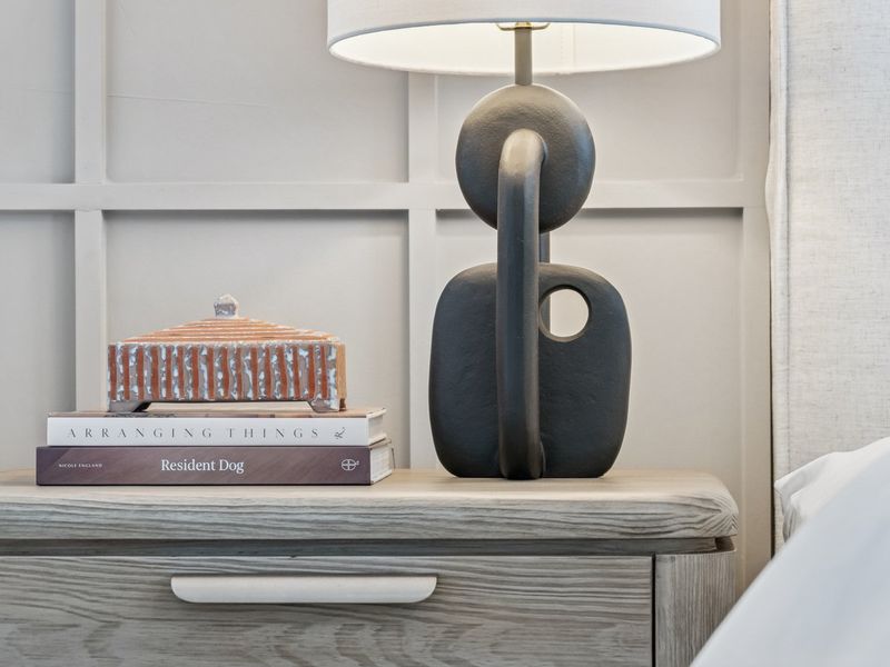 A lamp on top of books.