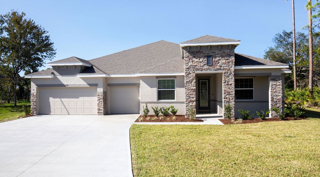 Front exterior of a home in the Magnolia Estates community, located in Lakeland, FL (Image 2).