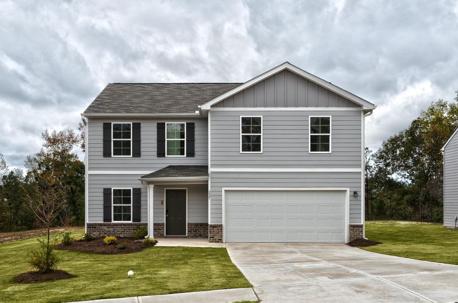 A white house with a garage.