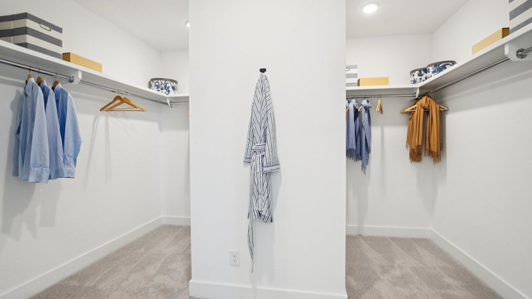 Large walk-in closet divided into two sections