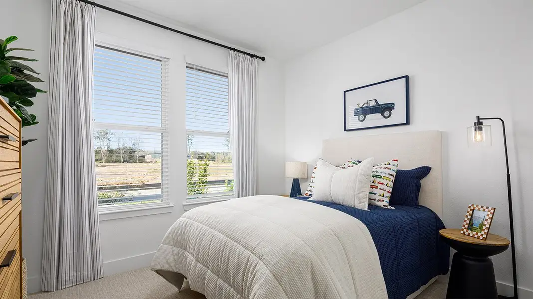 Furnished interior in a model home at The Canopies in Splendora (Image 10).