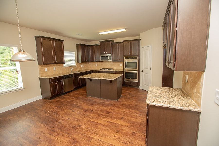 Furnished interior in a model home at Creekside at Scarborough in College Park (Image 5).