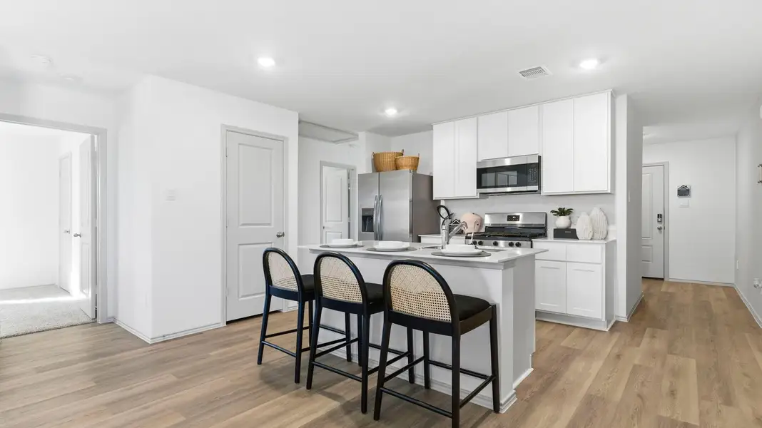 Furnished interior in a model home at Watermark in Alvin (Image 7).