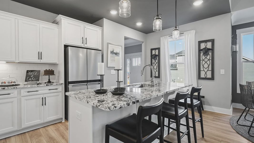 Lakehurst kitchen with dark ceiling, modern accents, crown molding, modern decor and granite countertops at Village at Midway Lakehurst kitchen with dark ceiling, modern accents, crown molding, modern decor and granite countertops at Village at Midway