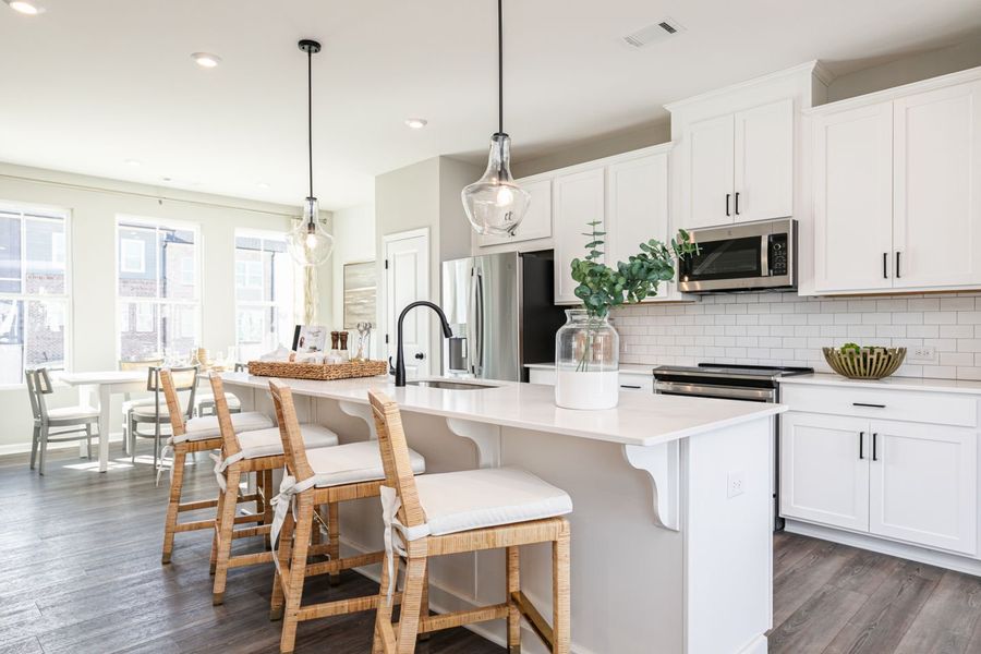 Chef-inspired kitchen with spacious island and storage that keeps life organized