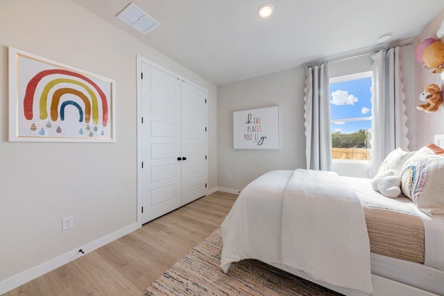 Furnished interior in a model home at The Woodlands in Mico (Image 29).