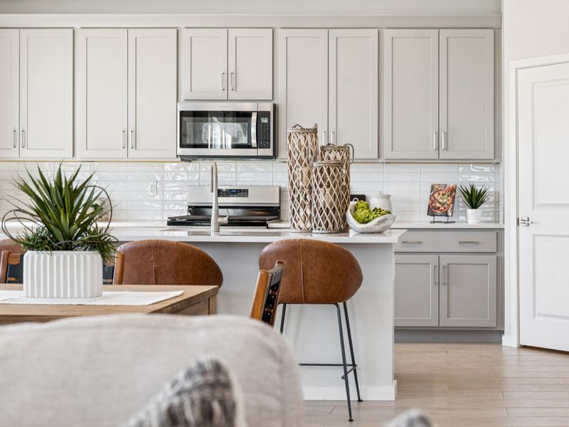 A kitchen with white cabinets. A kitchen with white cabinets.