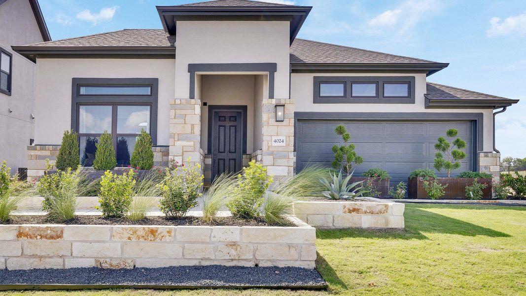 Elegant stone accents, expansive windows, and pristine landscaping define this Lakeside Meadows gem. Elegant stone accents, expansive windows, and pristine landscaping define this Lakeside Meadows gem.