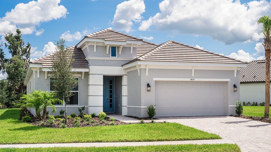 Front exterior of a home in the Esplanade Lake Club community, located in Fort Myers, FL (Image 36).
