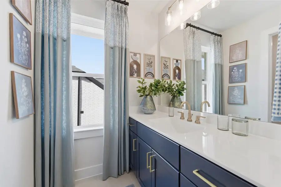 Furnished interior in a model home at Wildrye in Waller (Image 56).