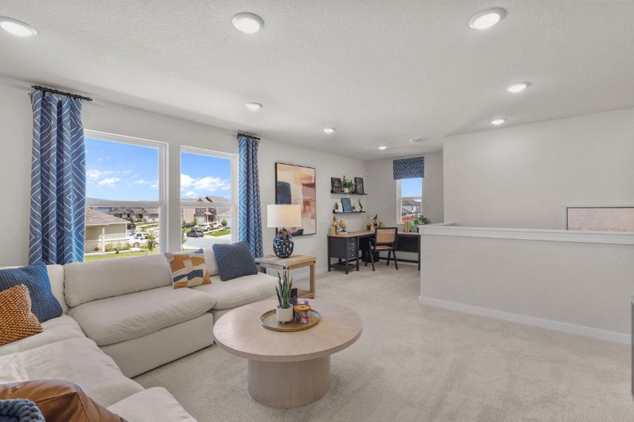 A living room with a large window.