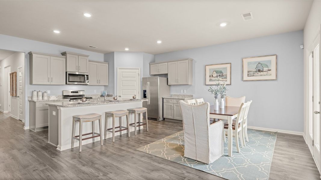 Furnished interior in a model home at Highland Hills in Graniteville (Image 3).