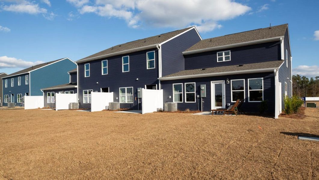 Front exterior of a home in the Townes at Seabrooke community, located in Leland, NC (Image 10).