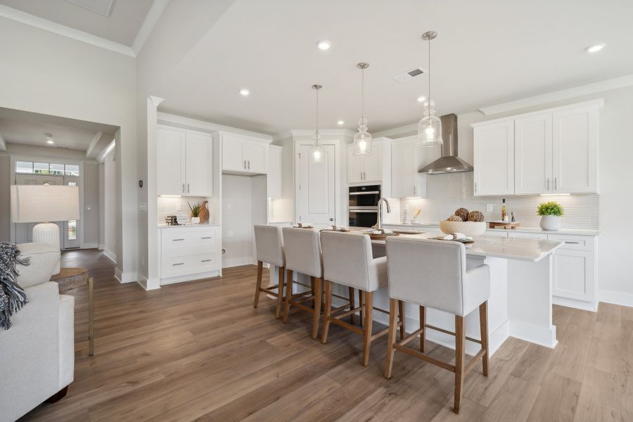 A kitchen with white cabinets. A kitchen with white cabinets.